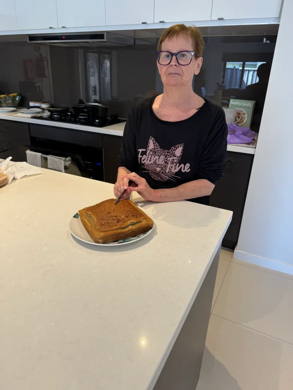 Elizabeth cutting banana cake